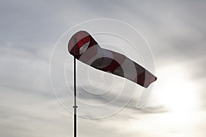 Windsock on the pole fluttering in the wind