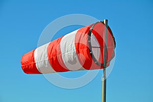 The windsock on the sky background