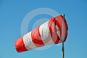 The windsock on the sky background