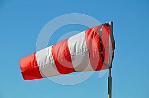 The windsock on the sky background