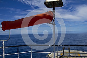 Windsock, white and red, indicating the position of the wind photo