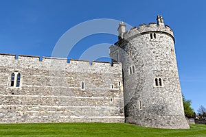 The tower and wall near King Henry VIII Gate of Windsor Castle, royal residence at Windsor in county of Berkshire, England, UK