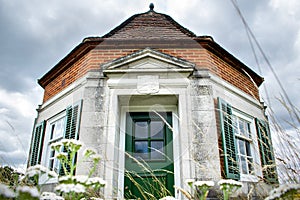 Windsor, United Kingdom - 28 July 2020: One of the Pair of Lutyens Kiosks on the Runnymede meadow, wide angle front view of