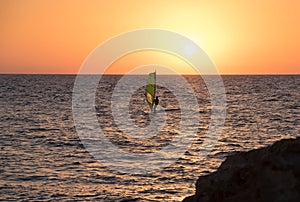 Windsurf in Mediterranean Sea at sunset.Tel-Aviv