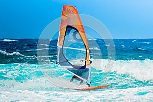 Windsurf riding the waves during a summer day photo