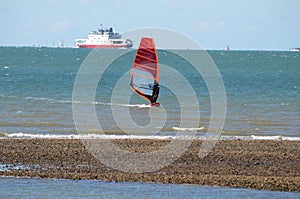 Windsurfer with ferry in the background