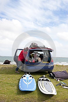 Windsurfer getting ready from his car