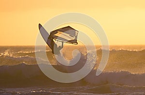 Windsurfer jump sunset