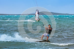 Windsurfer and kitesurfer