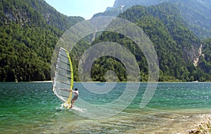 Windsurfer in a mountain lake