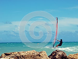 Windsurfer in rough sea