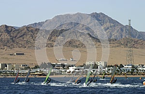 Windsurfer's race in blue Lagoon, Dahab, Egypt photo