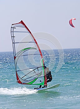 Windsurfer on sunny Tarifa beach in southern Spain