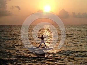 Windsurfer at the sunset