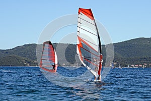 Windsurfers surfing in the Adriatic Sea