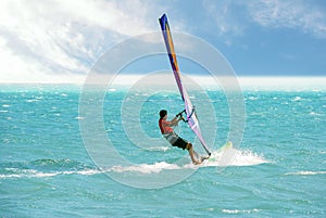 Windsurfing on beautiful blue ocean