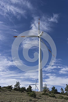 Windturbine against blue sky