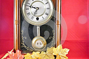 Windup penderlim clock with a wooden casing