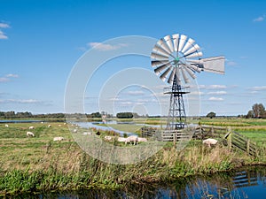 Windwatermill draining wetland polder, water level control in national park Alde Feanen, Friesland, Netherlands