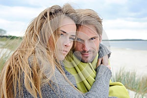 Windy autumn days relaxing on coast - sand dune, beach, beautiful couple