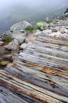 Windy foggy morning at lake