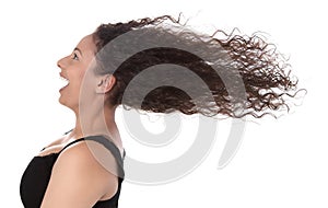 Windy: profile of laughing woman with blowing hair in wind isolated on white background