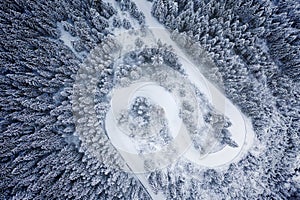 Windy road in mountains covered with snow