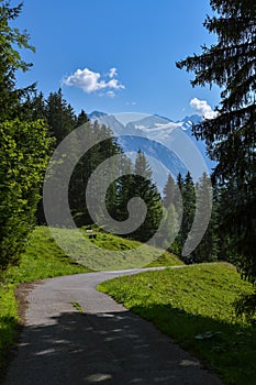 Windy road in Swiss Alps with majestic view on Wetterhorn peak