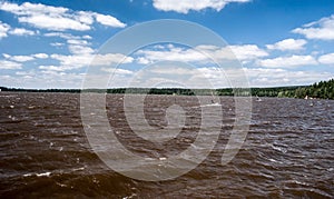 Windy Velke Darko pond with sailboats and blue sky with clouds in Czech republic