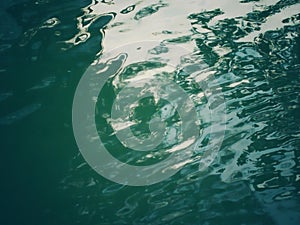 Windy water surface with wave and shadow photo