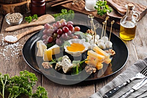 Wine appetizer platter with cheese and honey