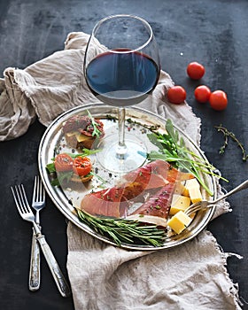 Wine appetizer set. Glass of red wine, vintage