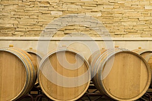 Wine barrels stacked in the cellar of the winery. Wine barrels in wine-vaults
