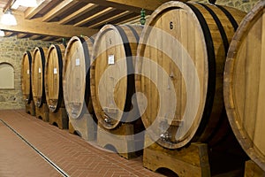Wine barrels stacked in the old cellar