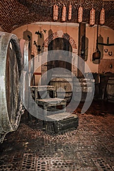 Wine Barrels Stacked in Winery Cellar