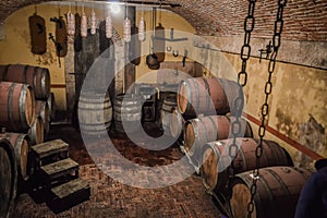 Wine Barrels Stacked in Winery Cellar