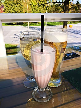 Wine beer and milkshake on the table