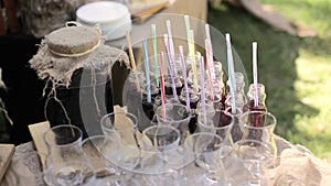 Wine, beer, water and soft drinks on the bar counter at wedding hall banquet, straw, close up