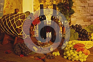 Wine bottle,  barrel for wine, glass of wine and grapes. white and  red wine on old wooden table