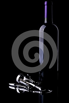 Wine Bottle and Chrome Corkscrew on Black