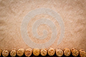 Wine bottle corks pattern on craft paper background top view copyspace. New Year celebration concept