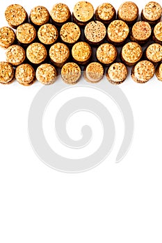 Wine bottle corks pattern on white background top view copyspace. New Year celebration concept