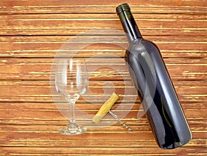 Wine bottle and glass on background wooden slats