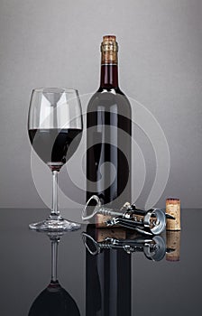 Wine bottle and glass with corckscrew
