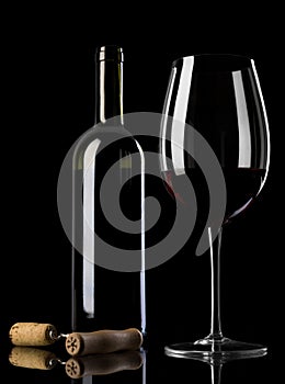 Wine bottle with glass and corkscrew