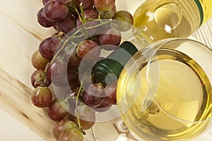 Wine bottle, glass and grapes