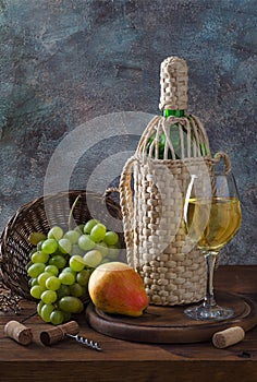 Wine bottle, glass and grapes