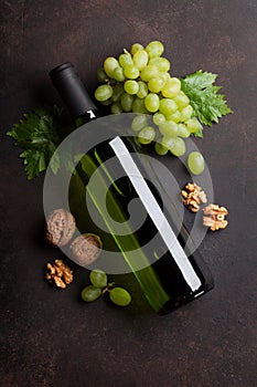 Wine bottle, grape and nuts