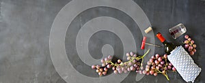 Wine bottle,grapes,corkscrew and wine cork,flat lay, panoramic, copy space