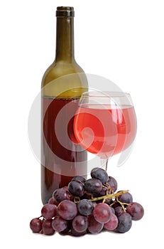 Wine bottle and grapes on white